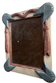 K1546 Late 19th century patriotic Folk Art decorated wooden framed mirror boasting red, white and blue painted frame with applied wooden rope and tassels. Original glass retaining nice silvering held in place with original wooden back. Bottom left corner broken off thick glass mirror  however it does not interfere with integrity of the piece. Approximate measurements at widest / tallest points:  14 wide x ~1 ¾ thick x 16 ¼ tall. 