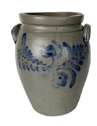 K165 19th century cobalt blue decorated 2-Gallon Stoneware Crock attributed to Peter Hermann (1825-1901) of Baltimore, Maryland. Ovoid shape with tooled shoulder, grooved collar with squared rim and applied lug handles. Prominently stamped 2 beneath one of the handles. Fantastic hand brushed Cobalt flowers and leaves encircle the crock along the shoulder. Circa 1840s-1860s. Hairlines to bottom and minor chips along the rim. Measurements: 6 5/8 diameter (bottom) x 8 ½ diameter (top) x 12 tall.