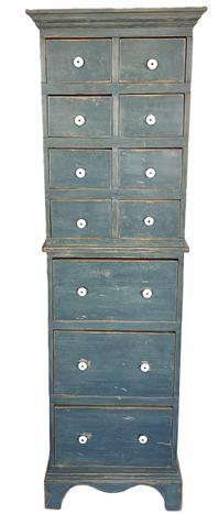 **SOLD** L18 Spectacular mid-19th century New England original blue painted Apothecary Cabinet featuring a very unique tall form with 11 drawers bearing their original porcelain knobs. The case features applied molding around the top, mortised drawer stretchers and rests on an applied bracket base with cut out feet. The wood is pine  with square head nail construction. Circa 1850s-1860s. Measurements: 23 wide x 11 deep x 74 tall.   