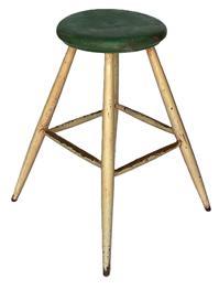 K328 Tall round splay legged wooden stool boasting the original green and white painted surface with excessive wear on the stretchers from many years of use. Very sturdy. Measurements:  Top is 13 ¼ diameter x 1 ¾ thick. Overall height is 26 tall and it measures 20 wide across splayed feet. 