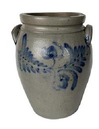 K165 19th century cobalt blue decorated 2-Gallon Stoneware Crock attributed to Peter Hermann (1825-1901) of Baltimore, Maryland. Ovoid shape with tooled shoulder, grooved collar with squared rim and applied lug handles. Prominently stamped �2� beneath one of the handles. Fantastic hand brushed Cobalt flowers and leaves encircle the crock along the shoulder. Circa 1840s-1860s. Hairlines to bottom and minor chips along the rim. Measurements: 6 5/8� diameter (bottom) x 8 &frac12;� diameter (top) x 12� tall. 