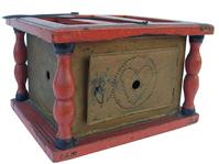 W288 19th century Foot Warmer, with the original bittersweet red paint decorated with black pin stripes,  with baluster-turned supports; punched tin is decorated with circle and heart. Retains its original coal holder inside. . American, mid- 9" wide *" deep  wide x 6" tall