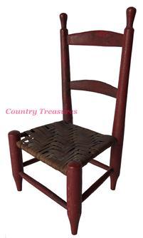E553  Miniature Ladder Back Side Chair, Original Tomato-Red Paint, Original Seat ,turned tapering stiles with finials join two arched slats. Pennsylvania, Circa 1800 Measurements: 11" tall  5 3/4" wide 5" deep