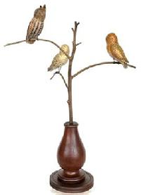 **SOLD** K99 Handmade 20th Century Folk Art Owl Tree with three different, beautifully hand carved and polychrome painted wooden Owls resting on steamed and bent branches. Mounted in a turned base for display purposes. Signed, and branded on bottom, "Ken Kirby".