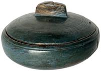 **SOLD** H1049 Treenware lidded bowl retaining blue painted surface. Beautiful natural patina interior with visible hand hewn marks throughout. Small �handle� on top of lid is carved from the same piece of wood as the lid itself. Ever so slightly raised foot, evidence of hand turned lathe marks on exterior. No cracks. Approximate measurements: ~4 ¾� diameter x ~2 ½� to top of handle on lid.