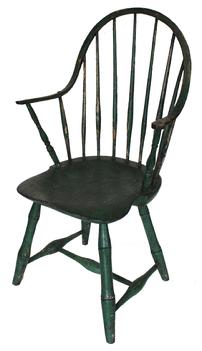 D37 Lancaster County Pennsylvania Continuous Arm chair retaining its old green paint. Bamboo style turned legs with a nice saddle seat typical to the late eighteenth century. Measurements 37 tall  20 1/2 wide 16 1/2 floor to seat 