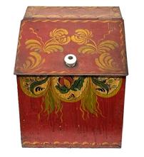 M1105 Tin countertop bin for storing Tea. The tole painted decoration is hand painted in mustard, green and black on a red-colored background.  Original white porcelain knob remains intact on slanted hinged lid. Measurements: 10� wide x 10� deep x 11� tall (back) x 8� tall (front). 