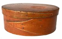 G833 New England Pumpkin red painted steamed and bentwood oval shaped pantry box. Uncleaned surface , pine and maple, oval form with opposing finger-lap secured with tacks and wooden-pins. Retains original painted surface. Massachusetts. Mid 19th century. Measurements: 6 ½� x 5� oval x 2 ½� tall