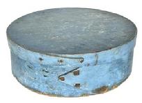 L364 19th century New England pantry box with opposing finger laps Pantry Box with beautiful dry blue painted surface over the original green paint. Steamed and bentwood tiny wooden pegged construction with opposing finger laps being secured with tiny square head nails and tacks. Clean, natural patina interior. Measurements: 8 ¼ diameter x 2 ¾ tall.