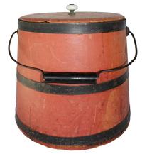 B447 19th century Sugar Bucket with bittersweet paint ,American, . with stave construction, metal bands and bale handle. bittersweet red  paint. porcelian knobs.  11" tall, 10"h. 9.5"diameter .