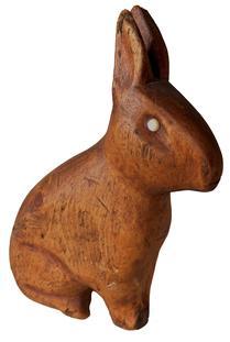 H239 Early 19th century folk art hand-carved wooden rabbit with applied eyes. Carved from one solid piece of wood and retains its original natural surface bearing great patina.