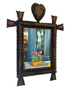 M81 Early 20th century American Tramp Art Mirror with a Heart bearing the initials �J. M.� and dated �1909�. Hand chip-carved and bears the original gold gild painted surface. Tiny square head nail construction.  Overall measurements: 11� wide x ~1� deep x 15� tall.