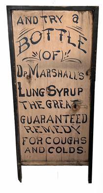 H1027 Early 20th century single sided advertising trade sign reading: �And Try A Bottle Of Op. Marshall�s Lung Syrup  - The Great Guaranteed Remedy For Coughs And Colds� Nice, dry painted surface with applied molding around three sides that extends beyond the sides to create �legs�. Measurements: 19� wide x 1 3/8� thick x 43� tall.