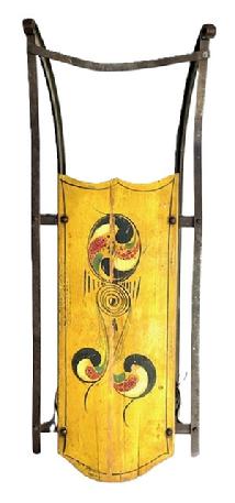 W59 Late 19th century to early 20th century original paint decorated Child’s Sled with red, green and white decoration on a mustard background with black pinstriping. Age-appropriate wear to the paint. Wrought iron runners with wooden platform. A wire has been attached for hanging purposes. Approximate overall measurements: 32” long x 12” wide x 9 ½” tall.