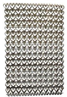 M49 19th century Folk Art Iron heart motif doormat constructed of individually handmade and bent heart shapes hooked together in a way that allows them to mold perfectly into the one next to it. These highly desirable heart mats were sometimes referred to as mud mats or sweetheart mats since the heavy metal would scrape mud from shoes/boots, and one was considered a sweetheart for the courtesy of doing so when entering a persons home. Circa 1880s-1920s. Measurements: 23 ¼ x 15 ¼ x ¼ thick.