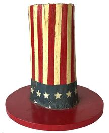 J366 Folk Art solid wooden Patriotic Top Hat featuring 13 white hand-painted stars on a blue field and a total of 24 alternating red and white stars and a red painted brim. Measurements: the brim is 13 1/2� diameter. Height is 13�. Top portion of the hat measures ~5 1/4� - 5 1/2� diameter. 