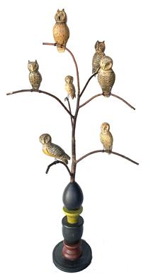 J438 Handmade 20th Century Folk Art Owl Tree, with seven different beautiful hand carved and polychrome painted wooden Owls in various poses resting on steamed and bent branches. Mounted in a turned multi-tiered, multi-shaped base for display that is painted in blue, yellow, green, red and black.  Signed, and branded on bottom, "Ken Kirby". Approximate measurements: ~17" across widest point x ~ 35" at tallest point. Bottom of base is 6" diameter. Owls range in sizes based on pose, but are each approximately ~3 1/2" - ~5� tall/long