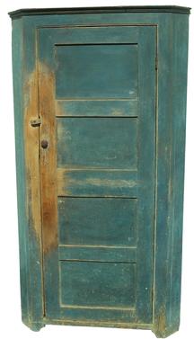 W339  Early 19th century Lancaster Pennsylvania one door Corner Storage Cupboard, with the original blue paint. The wood is white pine and poplar, the interior of the Cupboard has five shelves including the bottom, all natural wood with old patina, small applied molding at the top, four panel door, simple cut out foot. circa 1820 Measurements are 27 1/4" corner 72 1/2" tall