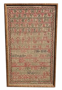 X15 Early 19th century Sampler stitched by Alison Duncan constructed of primarily red and green, with a small amount of black threads, stitched onto linen fabric. Features rows of repeating alphabets in capital letters with bands of geometric shapes separating each row. A nicely stitched zig-zag border encompasses the entire sampler. There are thirty-four (34) sets of initials hand stitched in the lower half of the sampler, just above the maker�s name. Provenance on back indicates this Sampler was purchased from an Estate sale in Frederick Maryland in March 1991. Measurements: 10 3/8" wide x 17 3/8" tall (framed)