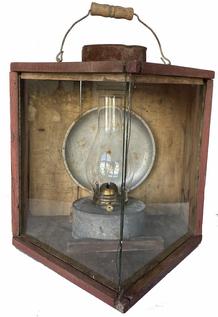 H75  Early 20th century triangular shaped wooden gunning light / lantern with glass front panels. Original wire on front to secure glass panels. Retains wonderful weathered red painted surface with pale mustard painted interior. DuPont Estate. Measurements: 15 ½� wide x 16� deep x 14� tall 
