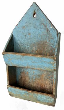 H903 Exceptional early 19th century New England double wall box in original blue painted surface. Square head nail construction with canted fronts on the wall pockets, tall triangular pointed cut out back and hole for hanging purposes. Measurements: 10 ½� deep x 4� deep x 19 ¾� tall.  