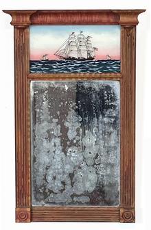 J292 Early 19th century Federal style Mirror featuring a hand-painted reverse painting of three tall-masted ships on the ocean/sea. The center ship bears several pennants and an early US flag flying proudly from its masts. The sturdy, solid wooden frame features detailed moldings, reeded sides and medallion corner blocks and bears its original pumpkin and yellow painted and decorated surface. Original mirror remains intact. Circa 1810. Measurements: 15� wide x 23� tall. 2 7/8� deep at top corners x 1 ½� deep at bottom corners.