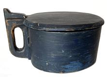 H1053 Original blue painted �Tankard� style treenware lidded box � featuring steamed and bentwood sides secured with woven reeds and tacks. Wooden handle. Chamfered edge around lid. Lid opens to reveal a clean, natural patina interior. Measurements: 9 ½� x 7 ½� x 5 3/8� tall.