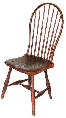 H194A  Late 18th to early 19th century Bow-Back  Windsor Chair retaining its original bittersweet red painted surface with seven spindle back raised on slightly splayed legs joined by an H-form stretcher. Nice, solid condition with great wear indicative of age. Circa 1790  1810. Measurements: 16 deep x 15 ¾ wide x 38 ½ tall (back) x 17 tall (seat front) 