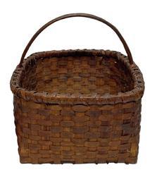 K192 Skillfully made heavy hand-woven natural Splint Oak basket with a squared, double wrapped, double wooden rimmed top that tapers slightly to a squared bottom. There are a few very minor losses due to age and use, but they do not affect the integrity of this sturdy basket. Measurements: 13 ½ x 15 across opening. The sides are 8 tall. Overall height is 14 tall to top of handle.