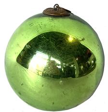 G889 Large Green ball Kugel ornament - Hand blown glass - nice weight and great condition with original cap and ring. Made in Germany between 1840 and early 1900. The green color is achieved by adding trace amounts of metal (iron) to the molten glass before it is blown into the spherical shape. Silver, gold and green � which brilliantly reflected candlelight, were the most popular colors. The word �Kugel� means �Round Ball� in German, but they were also made in the shapes of Grapes, Apples, Berries, Pears, Tear Drops, Pine Cones and Ribbed Melons. Measures 4" diameter. 
