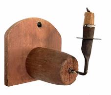 H994A 18th century wrought iron spike candle holder mounted into an original dry-red painted wooden backboard featuring a tombstone shaped top. Hole for hanging purposes. Measurements: 7 ½� wide x 7� deep x 7� tall. 