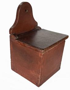 B637 Early 19th century Pennsylvania Salt Box with the original red paint. Dovetailed case featuring an arched back with hole for hanging. The wood is walnut. Circa 1820.  Measurements: 12 1/4" tall x 8" wide x 7 1/2" deep