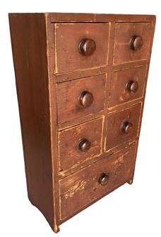 **SOLD** G725 Mid 19th century Pennsylvania seven drawer apothecary in original dry red painted surface. Dovetailed drawers retaining original knobs. The drawer divers are mortised into the case, and small curved cut outs on the feet/ends add to the visual appeal of this piece! Circa 1850s. Great form and size this Apothecary/ spice Chest is all original,   Measurements: 7� deep x 14 3/8� wide x 23 3/4� tall 
