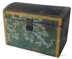 D192 19th century small Wallpaper-covered Wooden Dome-top Box, possibly Massachusetts, early 19th century, the wallpapered exterior is a floral design on a light blue field, trimmed with mustard 