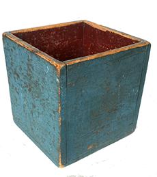 G737 Late 19th century to early 20th century wooden box with beautiful blue painted exterior and red painted interior. Remnants of a red and black painted �brick� house front are visible on the bottom. Very heavy and sturdy with wear indicative of use. Measurements: 12 3/8� tall x 11 3/4� wide x 12� deep. The wood is 7/8� thick.