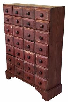 G118 19th century Pennsylvania red painted tall Apothecary Chest with twenty-eight drawers. The drawers are nailed construction and rest on an applied base with a nice high cutout apron. The drawer fronts are chamfered. The overlapping drawer fronts act as a drawer stop. Circa 1880      Measurements are: 31 ½ wide x 11 deep x 42 tall