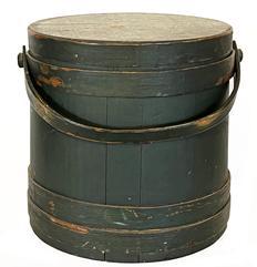 H967 Original Windsor green painted lidded firkin with tongue and groove softwood staved sides secured with tapered lap joint wood bands held in place with copper tacks. Remnants of maker's stamp visible on top of lid. Wooden swing handle attached by large buttonhead wooden pins. Very clean, natural patina interior. Measurements: 12 1/2" diameter (bottom) x 11 3/4" diameter (top) x 12" tall.