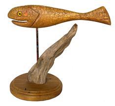 G678 Signed, hand carved and painted Fish decoy with glass eyes mounted on a piece of driftwood made by George W. Combs, Jr. (1943-2001) 
