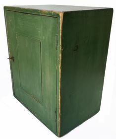 H959 19th century small hanging cupboard retaining an original green painted surface.The case of the Cupboard is dovetailed with Fully mortised and pegged raised panel door boasts beaded edges and a working original lock.