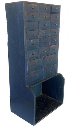 G724  Late 19th century Pennsylvania  very unusual apothecary in old indigo blue over the original salmon paint, the case of the apothecary is dovetailed, with a nice high display shelf with shaped sides
