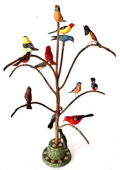 *SOLD* H385 American, 20th century Folk Art Bird Tree, with fourteen (14) beautiful polychrome painted and hand carved wooden birds resting on a steamed and bent branches in a colorful base that measures 5¾� in diameter. Various species of birds are represented, including a Red Wing Blackbird, Eastern Blue Bird, Oriole, Robin, Yellow Finch, Woodpecker and Cardinal � among others. Signed �M K Scheel� on the bottom.  Measures 27¾� tall.