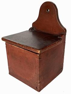 B637 Early 19th century Pennsylvania Salt Box with the original red paint. Dovetailed case featuring an arched back with hole for hanging. The wood is walnut. Circa 1820.  Measurements: 12 1/4" tall x 8" wide x 7 1/2" deep