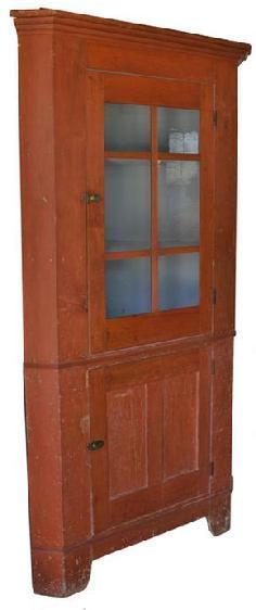 C211 19th century Pennsylvania six pane Corner Cupboard, with the original red paint, with old blue gray interior. High cut out base, with a waist molding. the wood is all white pine, circa 1840   83" high 39" wide