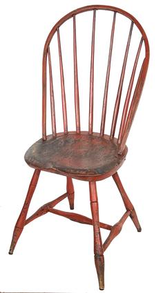 H196a  Late 18th century ,New England ,  seven spindle bow back Windsor Chair, early chair, with bamboo turned  .raised on slightly splayed legs joined by an H-form stretcher with a beautiful saddle seat,  in old bittersweet red  paint , circa 1790 �1810