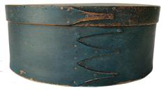 19th century Shaker Oval Pantry Box in old blue painted surface.  Measuring 10 1/2 long by 7 3/8 wide and 4 3/8 tal