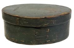 M1179 Fantastic, large 4-fingered Shaker oval pantry box with 4 finely shaped tapered fingers bearing original Windsor green painted surface. Steamed and bentwood constructed with a pine top and bottom and very thin maple or birch sides held in place with extremely tiny square nails and brass tacks. The fingers themselves are also secured with hand wrought brass tacks. Natural patina interior. Wear and patina indicative of age and use. Measurements:  11 &frac34;� x 9 3/8� oval x 4 5/8� tall.