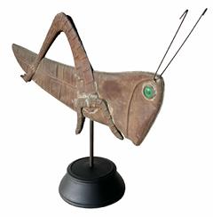 H433 Early 20th century Copper Grasshopper weathervane boasting applied legs and antennae that measure a full 6� long. Hollow body with hammered details and inset emerald green glass eyes. Mounted on wooden stand for display purposes.  Circa 1940-1950s. Measurements of grasshopper: 24� long x 13 ½� tall. Overall mounted height is 19� tall.