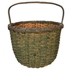 H210 Spectacular Eastern Shore, Maryland Basket featuring a double band rim with a steamed and bent, notched handle in the original dry, green paint. Nice, tight weave, with an interior double-woven bumped up bottom.