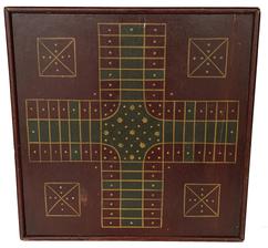 J31 Late19th century Pennsylvania wooden double sided Game Board with Parcheesi on one side and Checkers on the other. Retains untouched crackled original red painted surface with the Parcheesi board painted in green and gold polychrome colors and the Checkers side painted in black and gold polychrome colors. One board construction with applied molding on all sides that is attached with small square head nails. A tight age crack extends across entire board. Measurements: 17 ¼� square x ¾� thick.