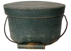 G268 19th century New England Bail Handle Pantry Box with the original dry windsor green paint ,with over lapping bentwood sides, secured with small metal tacks. The sides of the Box are fitted with a pair of oval stamped tin handle mounts. 